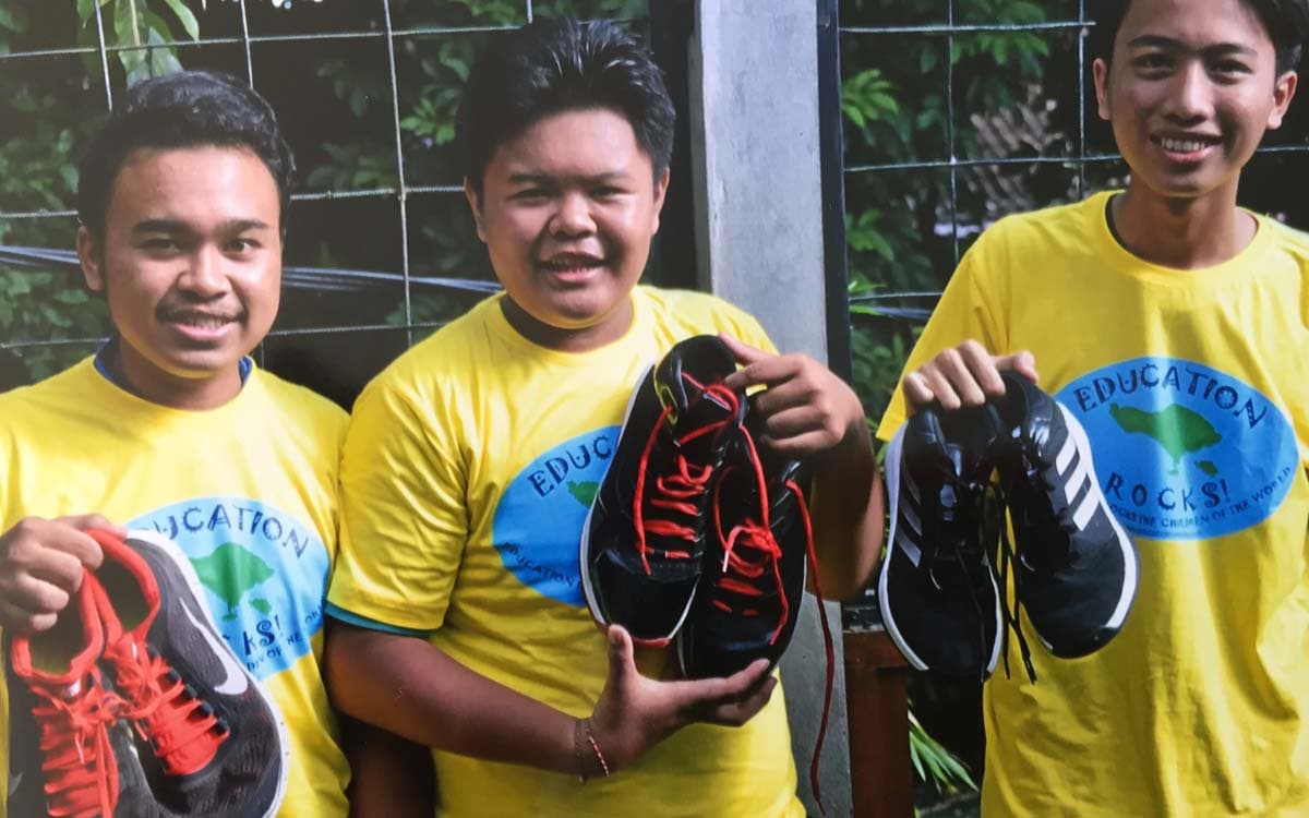 Children receiving shoes